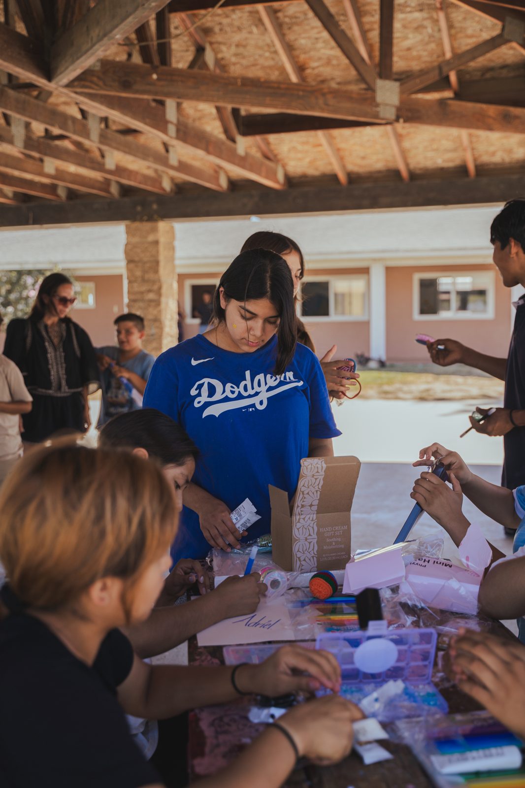 Children working on crafts during a community visit
